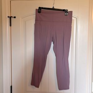 Athleta pink salutation leggings with stash pocket.